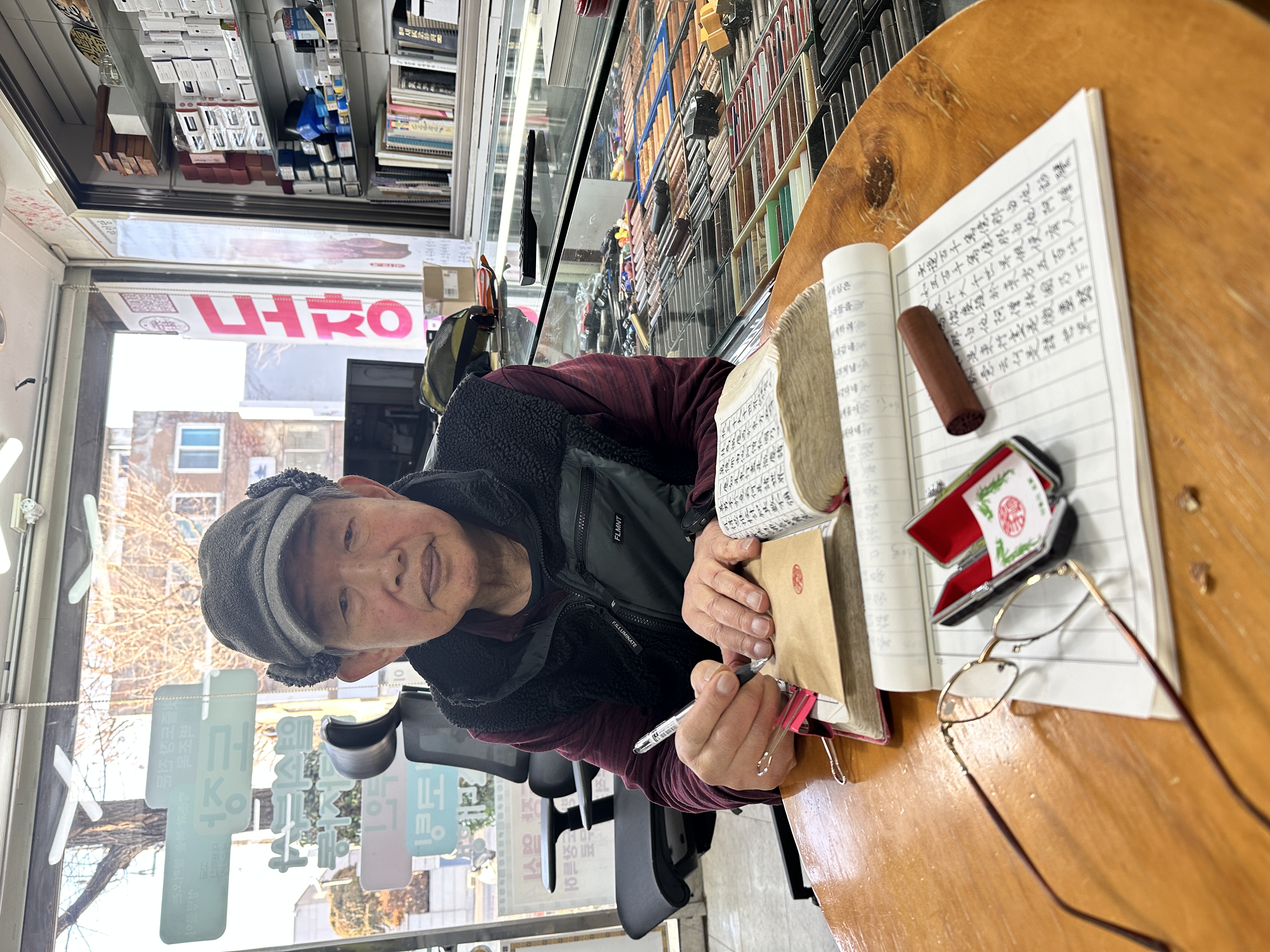 Master Kwon Tae Eung at his workbench, reading documents